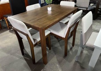 Brand new 5 Piece Wood Dining Set. Comes new in the box.