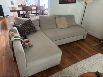 Comfy gray sleeper sectional with storage