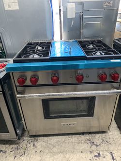 Wolf 36” slide in range with middle grill in stainless steel all gas