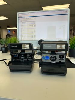 Vintage Polaroid Cameras both the One Step 600 film and One Step talking camera