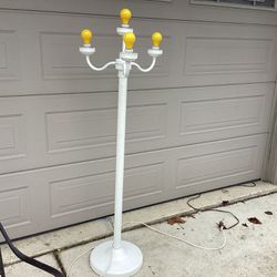 Electric outdoor/ indoor lamp post with 4 lights use standard bulbs 62 tall switch 3 setting ..globes come with it,weighted base for outdoor use ..