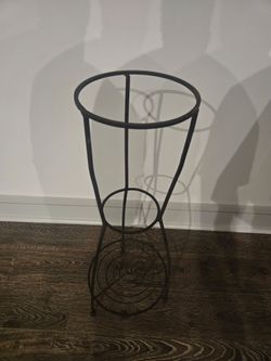 Tall dark metal plant stand