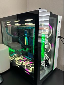 Custom Water-Cooled Gaming PC – RTX 3090 / i9 / 64GB RAM  Specs: • Intel i9-11900K • NVIDIA RTX 3090 • 64GB RAM • MSI MEG Z590 ACE Motherboard • 2TB N