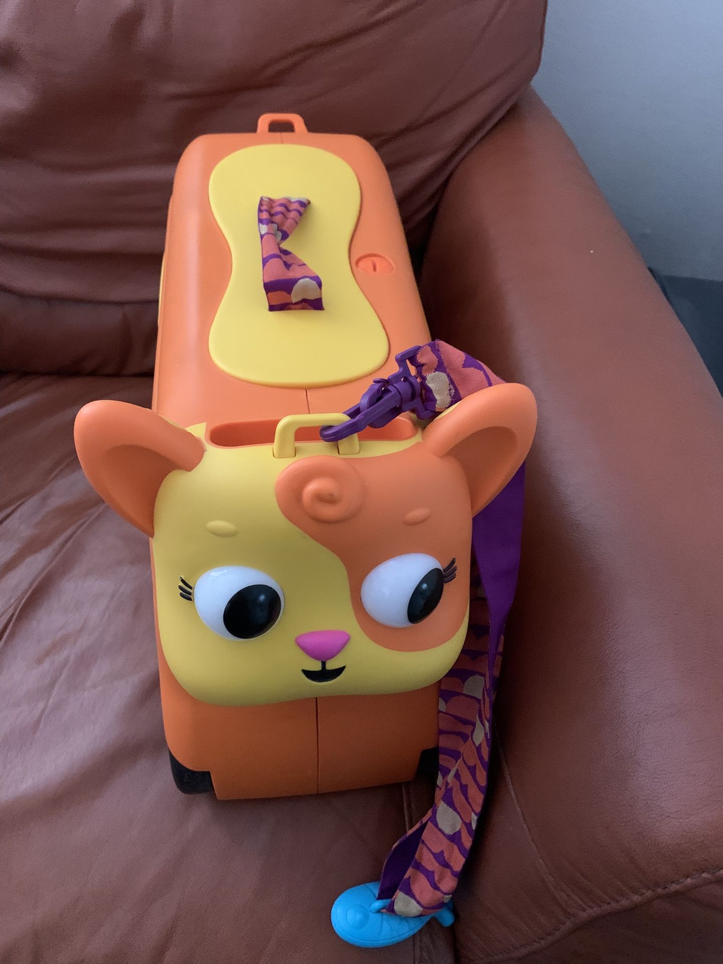 B. Toys Battat Cat Ride On Luggage