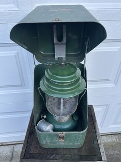Vintage Coleman lantern with unique metal case in good condition. Vintage looks like it’s 1965. I’ve not seen one of these cases before but they look 