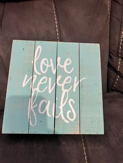 Love Never Fails Rustic Wood Sign