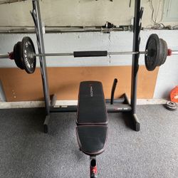 Adjustable Bench With Olympic Bar And 300lb Weights