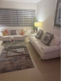 One leather sofa, bed, and one sofa in very good condition One leather sofa, bed, and one sofa in very good condition
