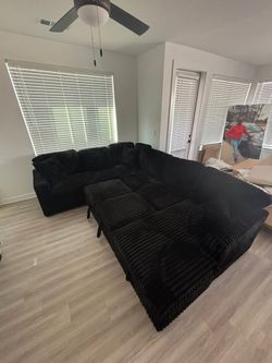 BRAND NEW LARGE BLACK CORDUROY SECTIONAL WITH STORAGE AND PULL-OUT BED