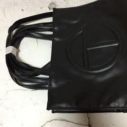  Telfar black Shoppe medium 			
