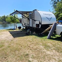 2021 RV IN PERFECT CONDITION NICE AND CLEAN SUPER EQUIPPED,MICROWAVE, REFRIGERATOR,STOVE,GRILL,QUEEN BED,TWIN BED,STORAGE, SLIDE SIDES,AC,HEATER,SHOWE