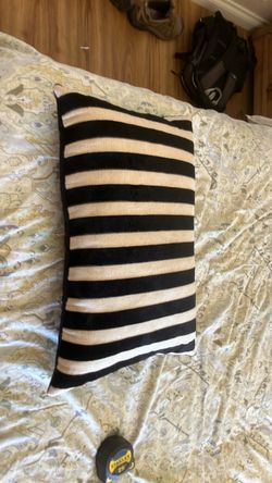 Black and tan throw pillow