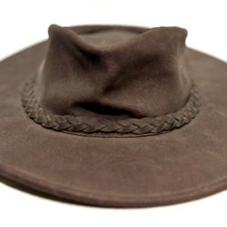 Minnetonka The Fold Up Hat made of genuine leather. This specific model in the image appears to be the brown or dark brown version, in a size large. 