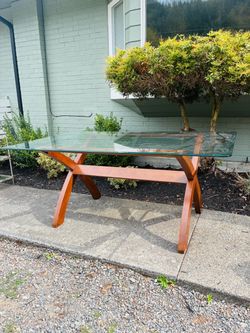 Glass top dining table with wood base