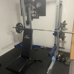 Power Rack, Bench, Barbell + Weights, And Trap Bar
