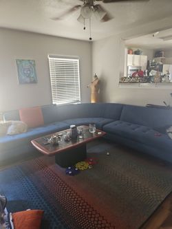 Free sectional Blue Couch and Area Rug