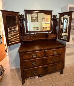Antique dresser with trifold mirror