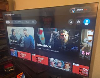 Samsung 55" T7 Smart TV with remote and swivel pedestal stand