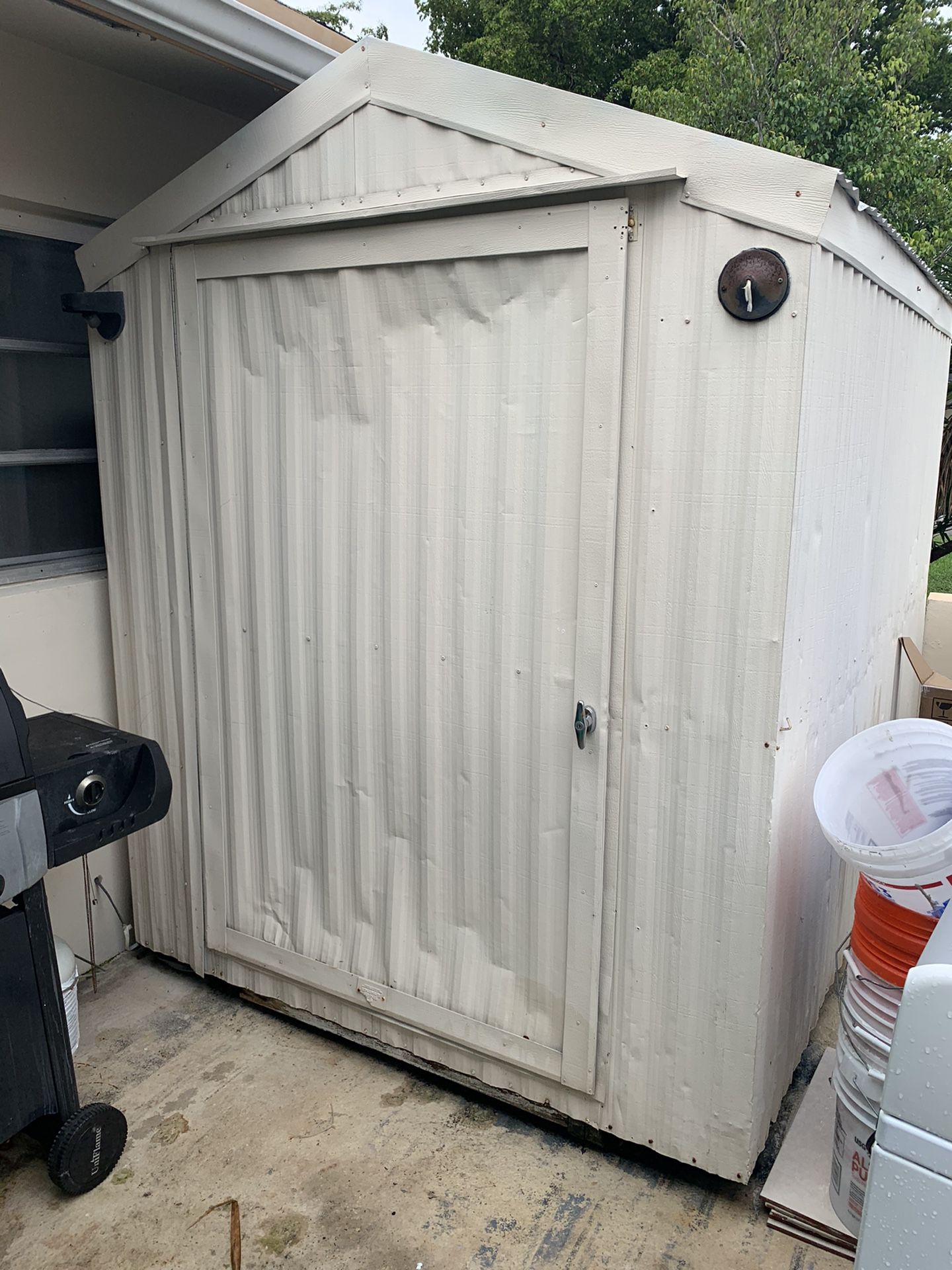 Aluminum shed with shelves and electrical hookups