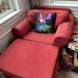 red sofa chair with foot rest and storage