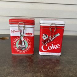 Coca Cola empty tin cans