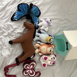 Assorted stuffed animals with bag and dog house