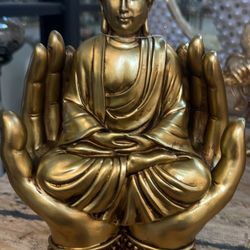 Golden Gautama Buddha in Protective Hands – Peace & Serenity Decor