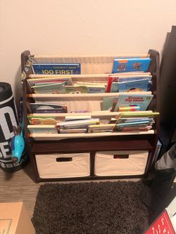 Children’s book shelf with storage, take any books you’d like!
