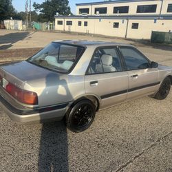 92 Mazda 4dr. Stick.  