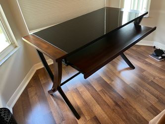 Stylish metal and wood desk with glass top