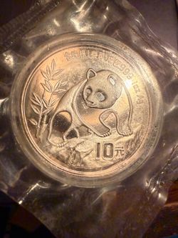 1990 Chinese Small Print10 yuk. original Panda  coin. an original sealed container..