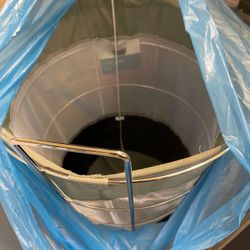 Hamper with fabric lining on wheels