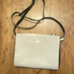 Kate Spade Crossbody purse and perfect condition has three departments two are closed with a zipper perfect condition