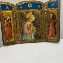 A Florentine triptych, the image on which is based on a painting by the Italian Renaissance artist Fra Filippo Lippi.  Folding icon (triptych) made of