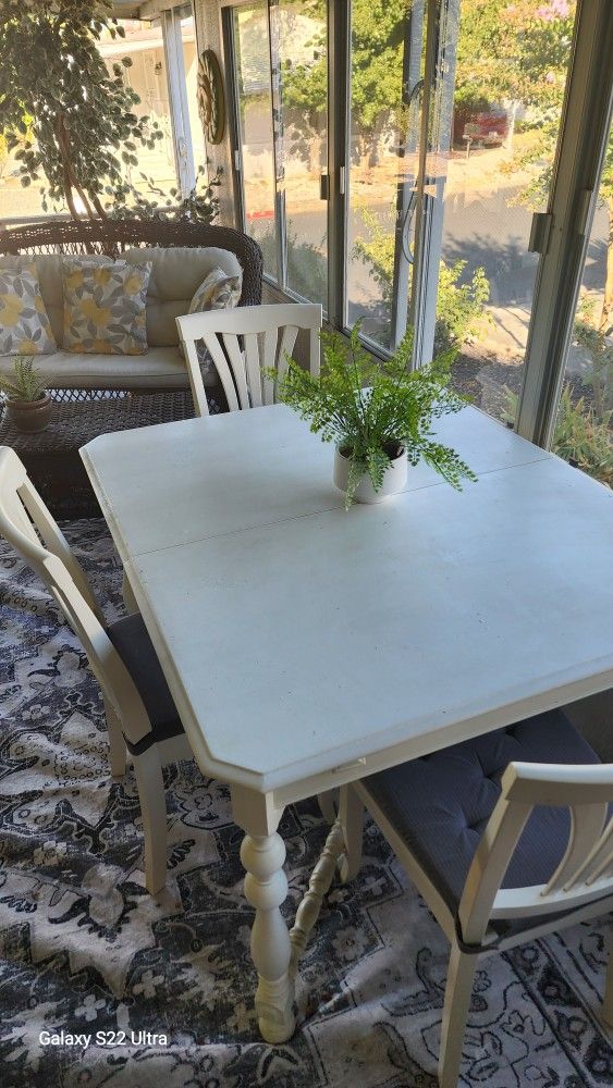 Vintage Style Table With New Chairs And Cushions