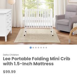 New in Box Delta Children Lee Portable Folding Mini Crib with 1.5-Inch Mattress White 