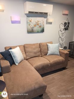 Beige couch with sleigh end cap 7ft L 4ft W.