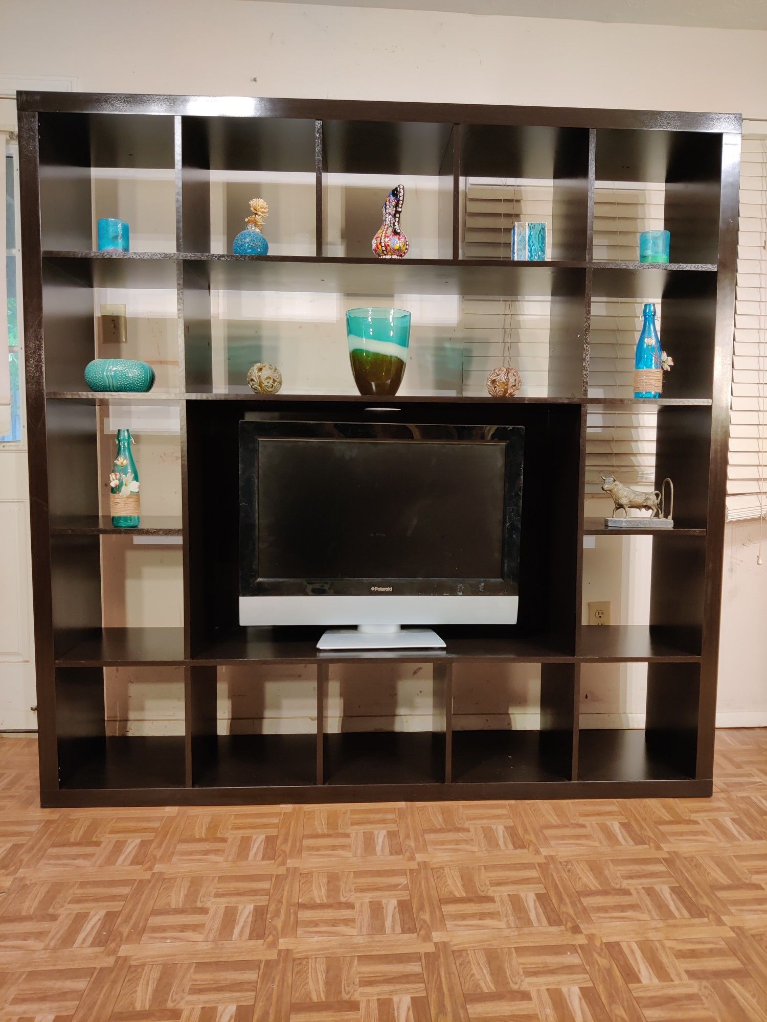 Nice TV stand/entertainment center with many shelves in good condition, we can take it part for easy pickup, driveway pickup. L72"*H72"