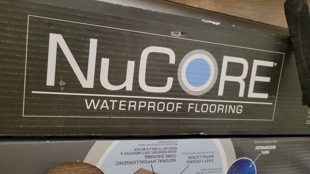 4 boxes of NuCore Driftwood Oak Nucore Flooring... BRAND NEW.