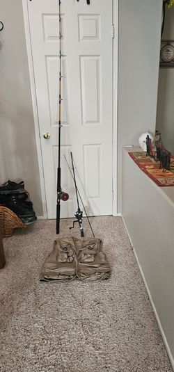 2 fishing poles and a fishing vest