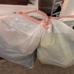 Bag of women clothes and women shoes and men shoes 