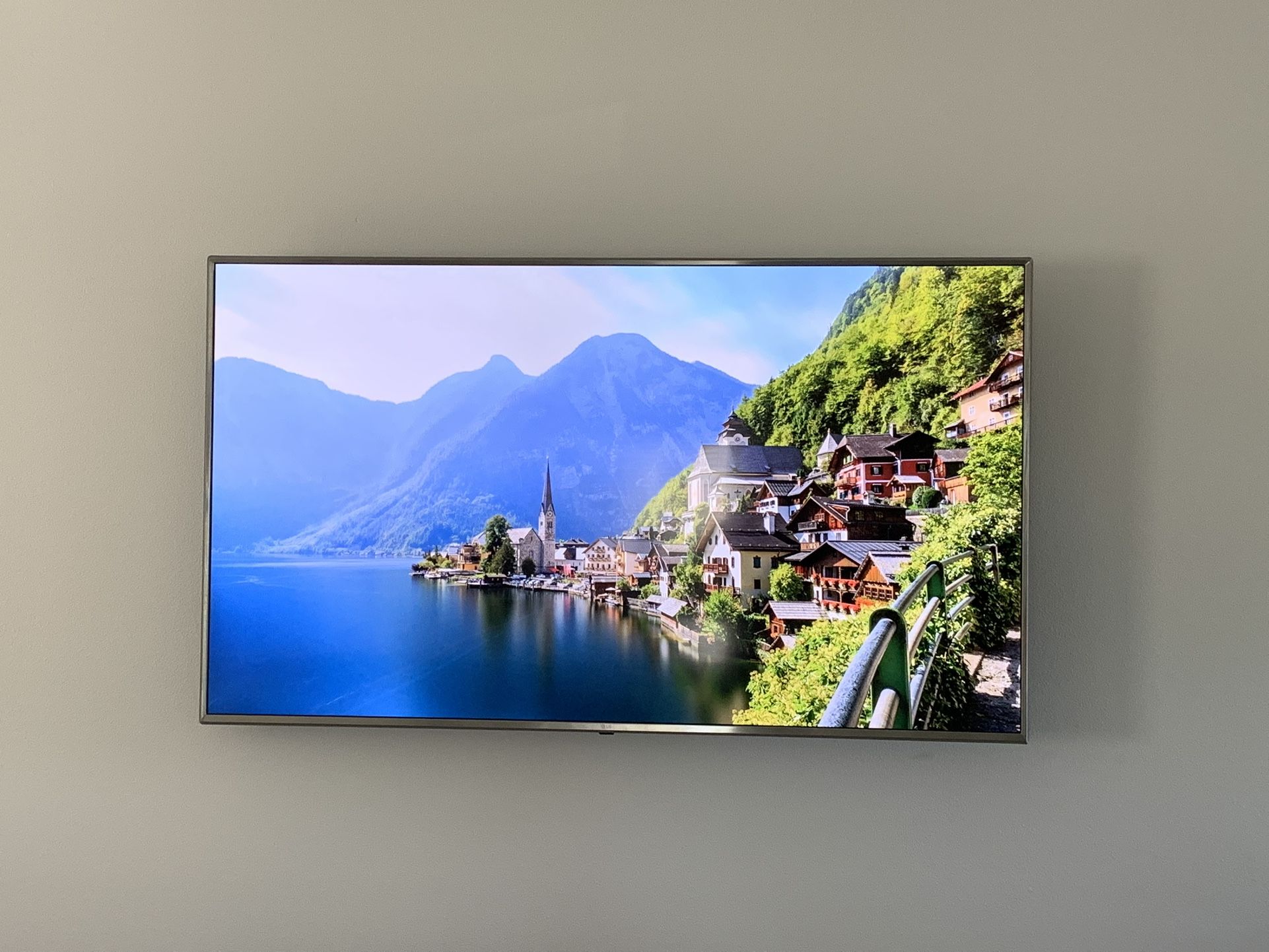 70 inch LG Smart TV and table.