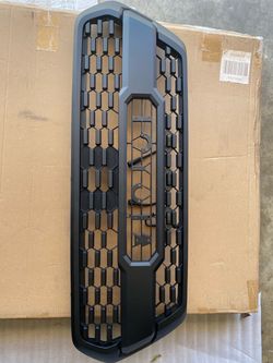 Toyota front grille designed for a 2016-2023 Toyota Tacoma.