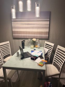 Table chair and wall art