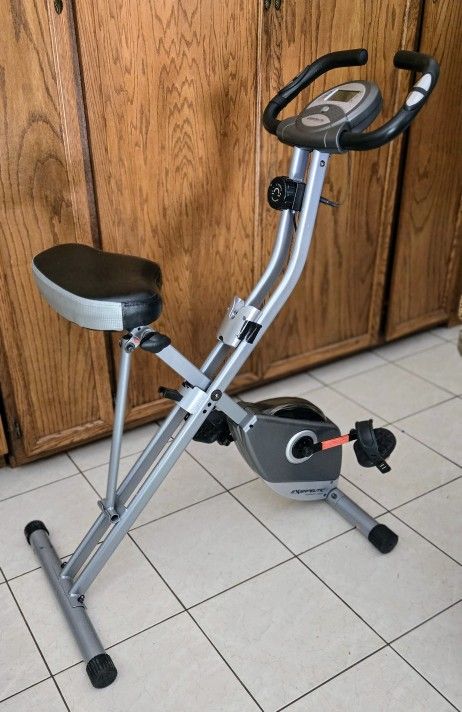 Exerpeutic Foldable Exercise Bike, 8 levels of Resistance Stationary Bicycle with Airsoft Seat, LCD Display to Track Distance, Calories, Time and Spee
