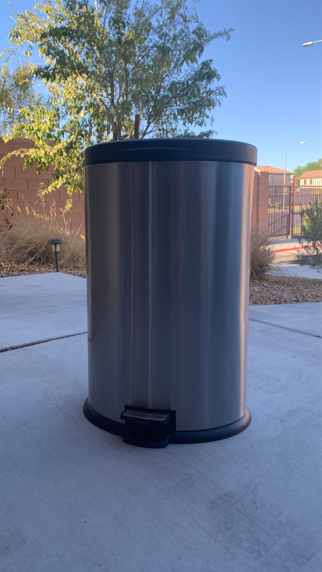 Silver and black kitchen trash can