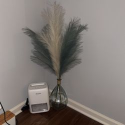 Lamp There Are Two, Rattan Side Table ,Glass Vase With Pom Decor 