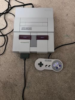 Super Nintendo console with Mario game