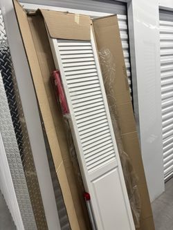 Kimberly Bay Traditional Louver-Panel 28 In. X 80 In. Solid Core White Primed Wood Bi-Fold Door With Hardware