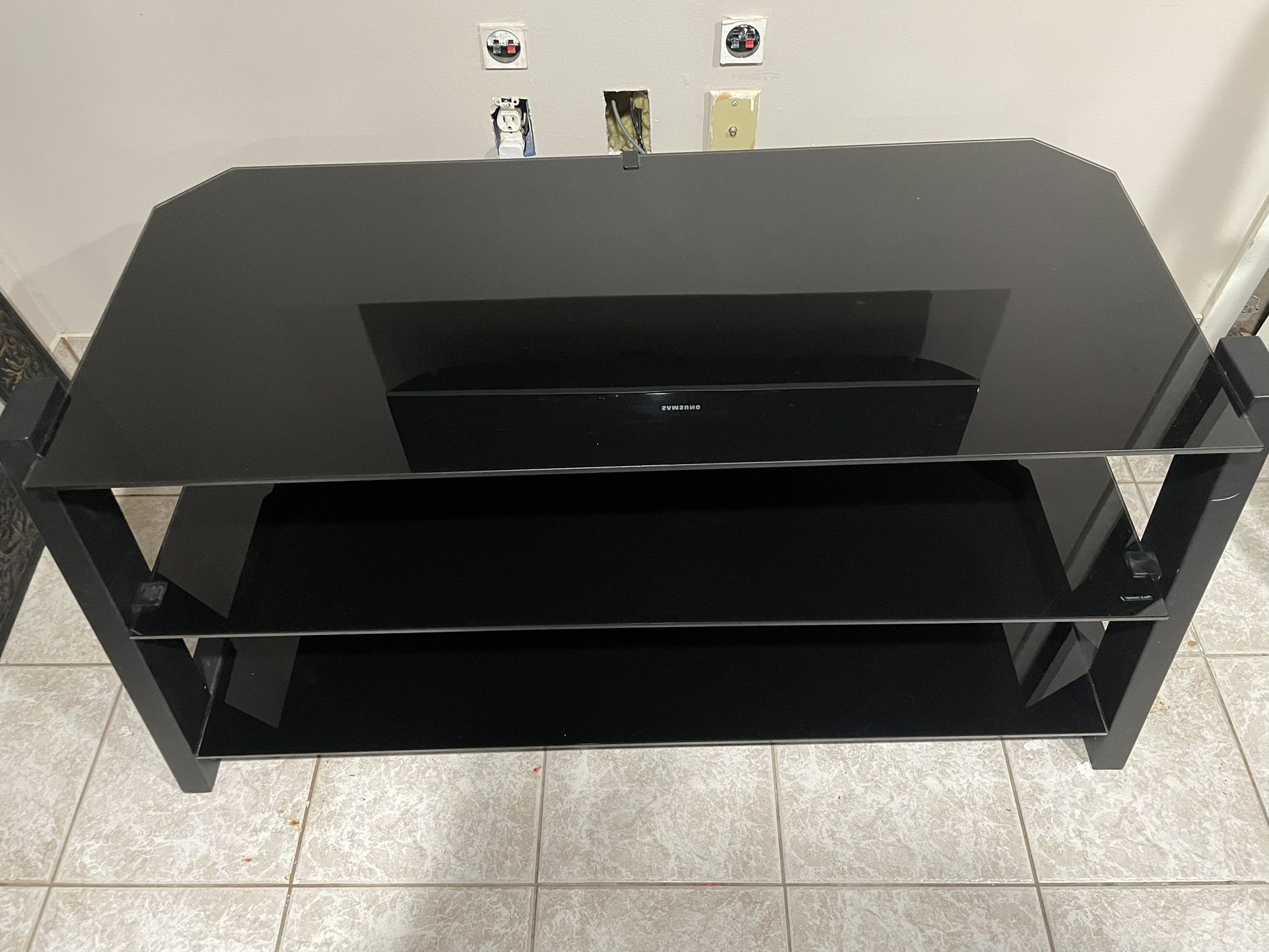 TV Console table - Black Glass in Great Condition. $130 OBO. Local Pick Up Only.